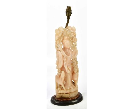 A 20th century Chinese hardstone carving representing Guan Yin, on turned wooden base with applied light fitting, height 52cm
