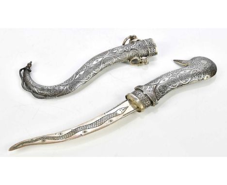 An Eastern white metal dagger, 32cm.Condition Report: Minor denting, surface scratches and wear.