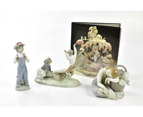 LLADRO; three figures including a figure with seesaw with a book.Condition Report: All appear in good condition, the seated g