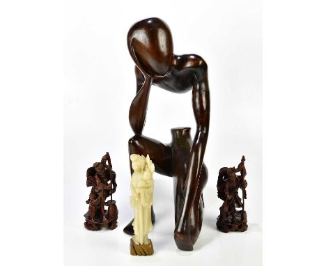 A large African carved wooden sculpture of a partial figure, height 60cm, with two rootwood carved figures and a carved soaps
