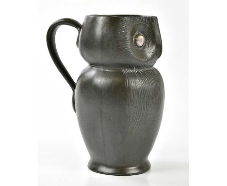 TUDRIC; an Arts & Crafts jug modelled as an owl, with enamel cabochon eyes, impresses marks and numbered 035, height 20cm.   