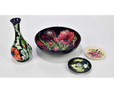 MOORCROFT; four pieces including a vase of baluster form decorated with poppies, height 23cm, a footed bowl decorated in the 