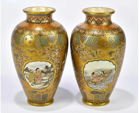 SATSUMA; a pair of Meiji period Satsuma vases of ovoid form, each finely decorated with figures on boat and figures within la