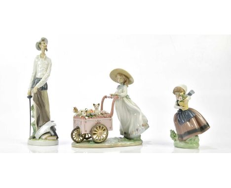 LLADRO; three figures to include, "kitty cart", " spring is here" and "Quixote standing up", all three boxed.Condition Report