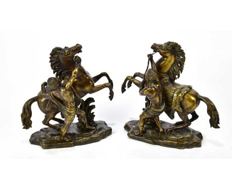 AFTER COUSTOU; a pair of bronze Marly horses, height 24cm.