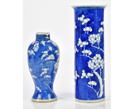 A late 19th century Chinese blue and white porcelain sleeve vase decorated with prunus flowers, bears Kangxi double ring mark