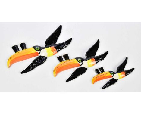 CARLTONWARE; three reproduction advertising Guinness toucan wall plaques, length of largest 26cm (3)