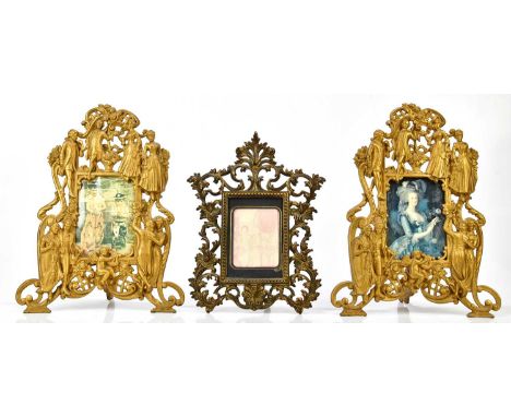 A pair of gilt metal easel back photograph frames modelled with Classical figures, height 35cm, with a similar example (3)