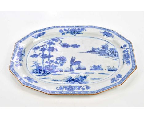 An 18th century Chinese Export blue and white plate, decorated with a stylised stag in landscape, length 32.5cm.Condition Rep