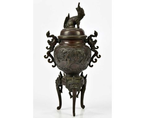 An early 20th century Japanese bronze twin handled koro and cover, relief decorated with floral sprays, height 27cm. 