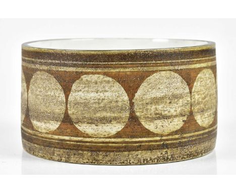 TROIKA POTTERY; a drum bowl decorated with a single band of circles, signed Troika, St Ives, England, with indistinct painted