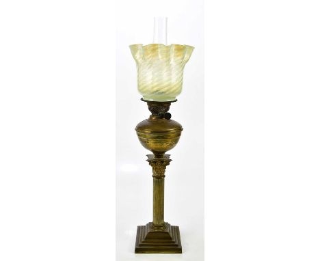 A 19th century brass oil lamp with shade and chimney, 73cm.