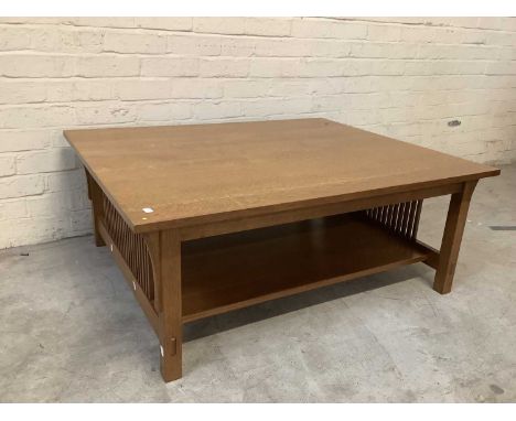 An Arts and Crafts style light oak low coffee table with undertier shelf, length 112cm, width 92cm, height 43cm.