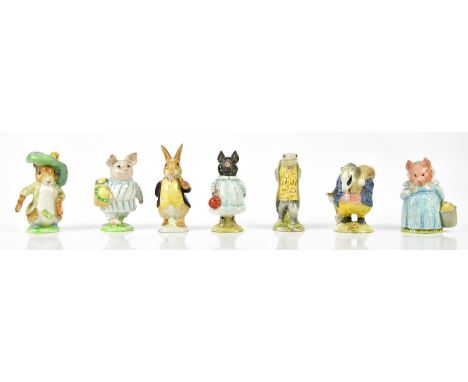 BESWICK; a collection of seven Beatrix Potter figures including Tommy Brock, Little Pig Robinson (gold back stamp), Benjamin 