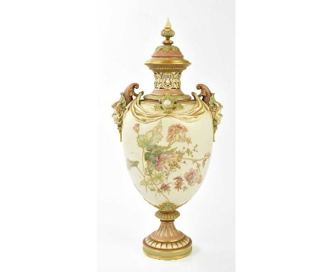 ROYAL WORCESTER; a large and impressive twin handled pedestal vase, the finial cover above reticulated neck and mask head han