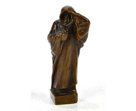 AFTER CHARLES SYKES; a small bronze figure of a cloaked bearded male, indistinct signature to the base, height 11cm.