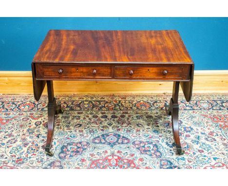 A 19th century mahogany drop leaf sofa table with two drawers, terminating on brass castors, width 96cm, depth 66cm, height 7