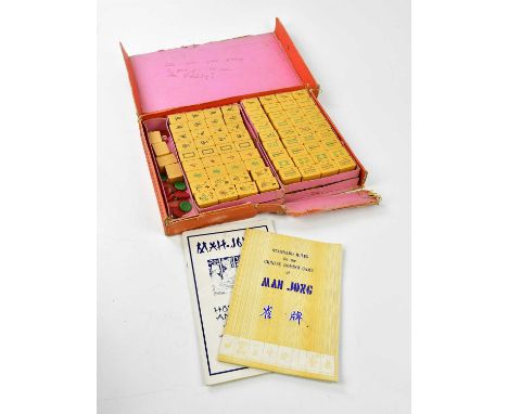 A Mahjong set, with instruction booklet.