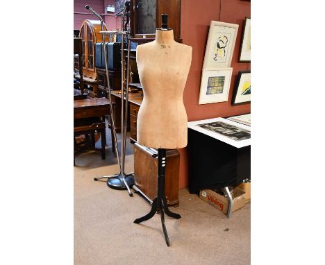 A vintage mannequin, on ebonised tripod stand, height 173cm.
