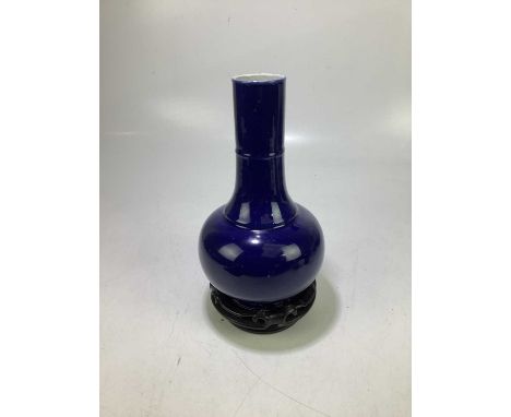 A late 19th century Chinese vase, decorated with an all-over blue glaze, four character mark to base, height 34.5cm, on carve