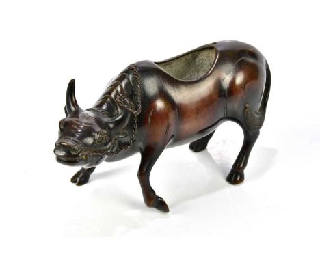 A Chinese bronze censer, modelled as buffalo, lacking lid, height 11cm.