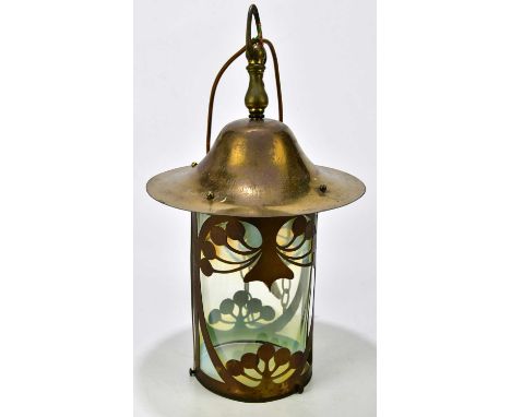 An Arts and Crafts brass ceiling light with vaseline glass shade, with applied stylised decoration, height 58cm.