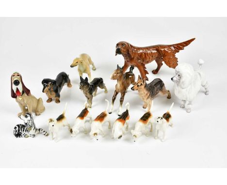 A group of various dog and horse figures to include Beswick, Royal Doulton and Wade examples.