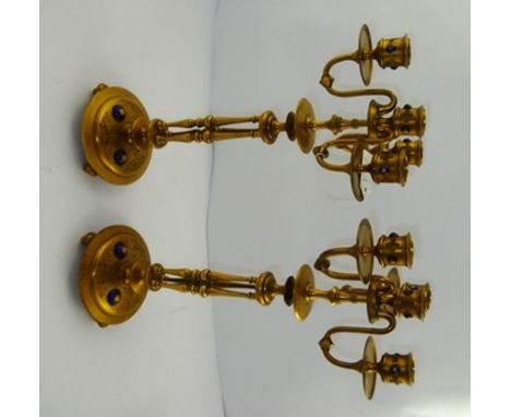 A PAIR OF LATE 19TH/EARLY 20TH CENTURY GILT BRASS FOUR-LIGHT THREE-BRANCH CANDELABRA, each having enamelled "bejewelled" scon