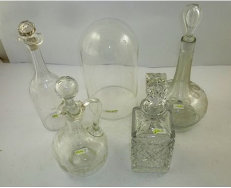 A LATE 19TH CENTURY CONTINENTAL ENGRAVED GLOBE AND SHAFT DECANTER, a JUG DECANTER, TWO OTHER DECANTERS, and a glass DOME, 26c