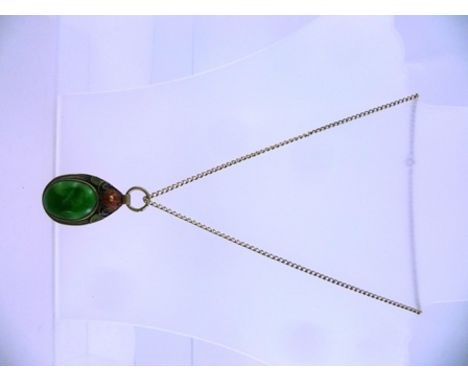 A JADEITE AND ENAMEL PENDANT set large oval green cabochon, signed on reverse, on a white metal chain 