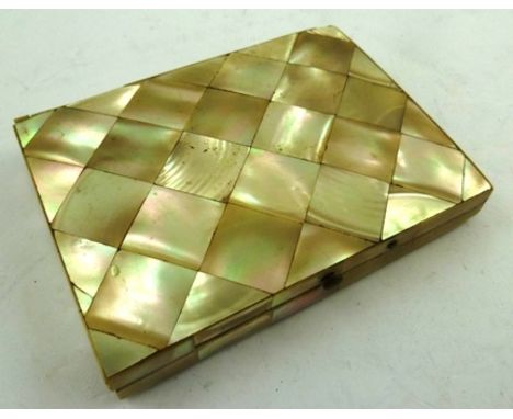 A VICTORIAN MOTHER-OF-PEARL VISITING CARD CASE, having lozenge layered front and back with paper compartmented interior, 10.5