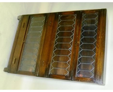 A GLOBE WERNICKE "CLASSIC" OAK BOOKCASE, having fitted three leaded glass up and over front sections and two drawers 