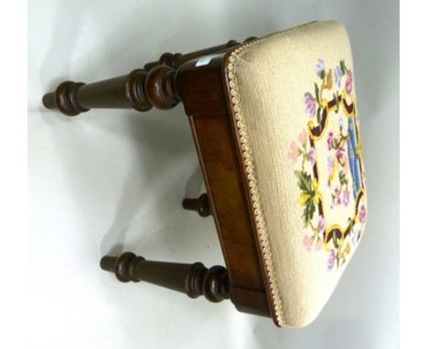 A VICTORIAN MAHOGANY FRAMED STOOL having woolwork upholstered seat, supported on turned supports 