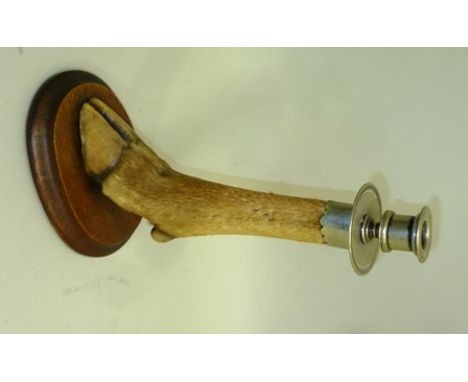 A DEER SLOT CANDLE STICK with metal nozzle and drip pan mount, on an oval oak base, 31cm high 