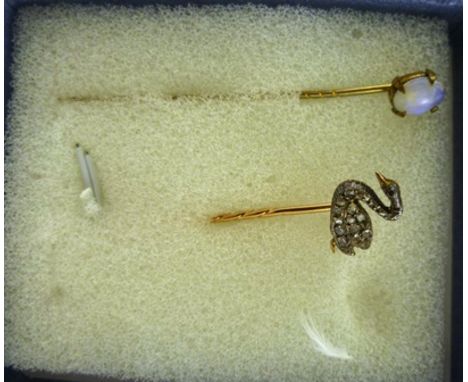 A DIAMOND MOUNTED GOLD TIE PIN fashioned as a Swan set with 20 bruted stones and another GOLD TIE PIN set oval cabochon moons