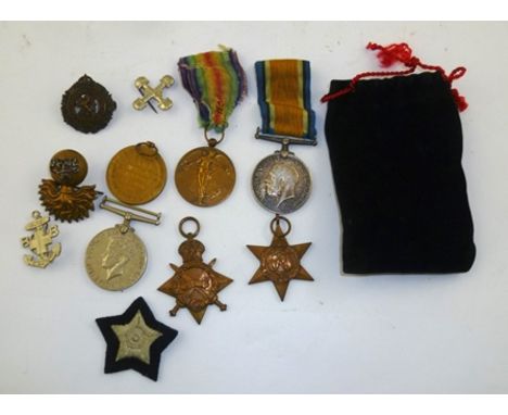 A QUANTITY OF FIRST AND SECOND WORLD WAR MEDALS AND BADGES includes; First World War Medals awarded to Pte. J. McGonigle of T