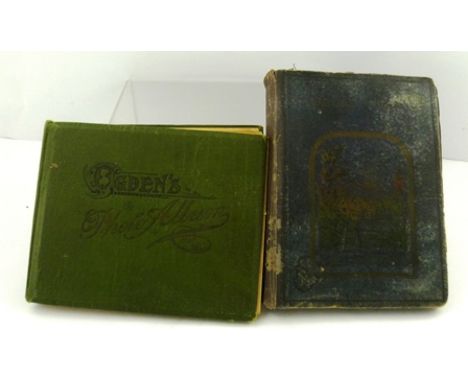 TWO ALBUMS OF CIGARETTE CARDS includes; Ogden's Guinea Gold Photographic Portrait cards and John Player "Cricketers 1930" 
