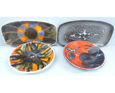 Four items of Poole pottery including three Delphine pattern dishes and a Aegean pattern oblong dish, two pieces crazed and s