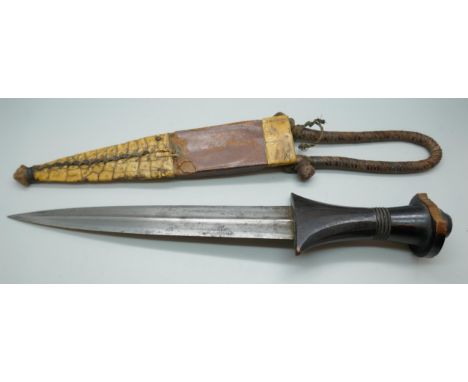 An African armlet dagger, handle chipped *This lot is not available for packing and posting