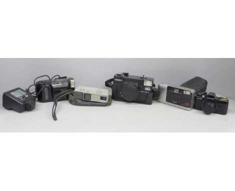 Five cameras, two Minolta, Canon, Konica and Pentax