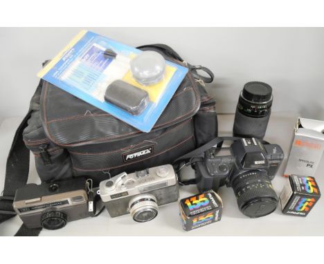 Cameras; a Ricoh XR-X camera together with two other cameras and lenses with accessories. 