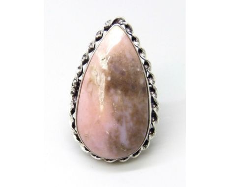 A silver plated ring with twist design border, set with a pear shape cabochon rhodonite stone, size J/K