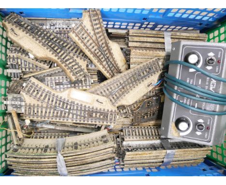 A box of Marklin Germany 00 gauge tinplate track and an AGW dual controller 