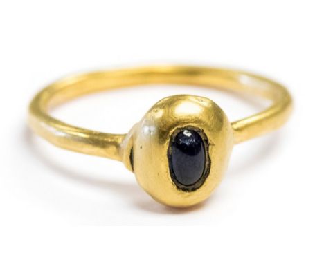 Medieval Gold & Sapphire Finger Ring. A high-carat gold ring of the 12th or 13th century, having an oval bezel, hexagonal in 