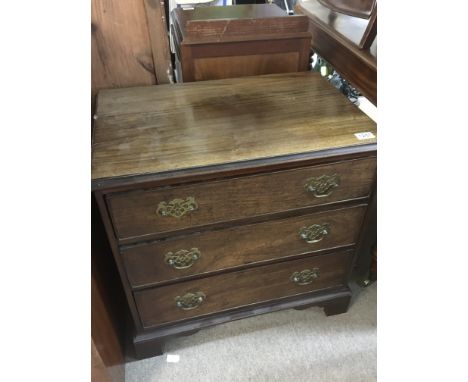 A small George III mahogany chest of drawers fitted with three drawers on bracket feet. 66cm high 45cm deep width 67cm.