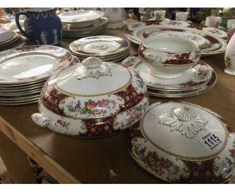 A part dinner service with a patterned boarder retailed by Waring & Gillow. NO RESERVE