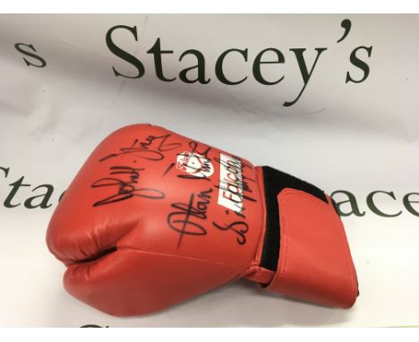 A multi signed boxing glove. Names comprising Sir Henry Cooper, John H Stracey and Alan Minter. Shipping category B.