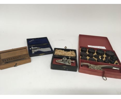 A collection of watch makers precision tools a cased Crystal and case press and other cased tools.