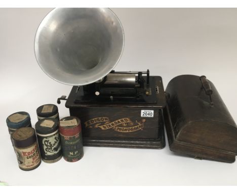 An Edison Standard Phonograph with a large quantity of music rolls some in boxes with an aluminium horn.