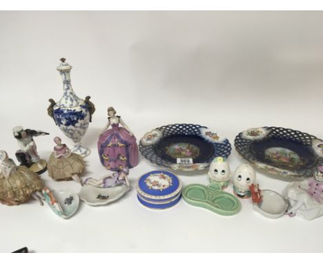 An Early 20th century Coalport blue and white vase a pair of decorative porcelain ribbon plates pin dolls and other ceramics.